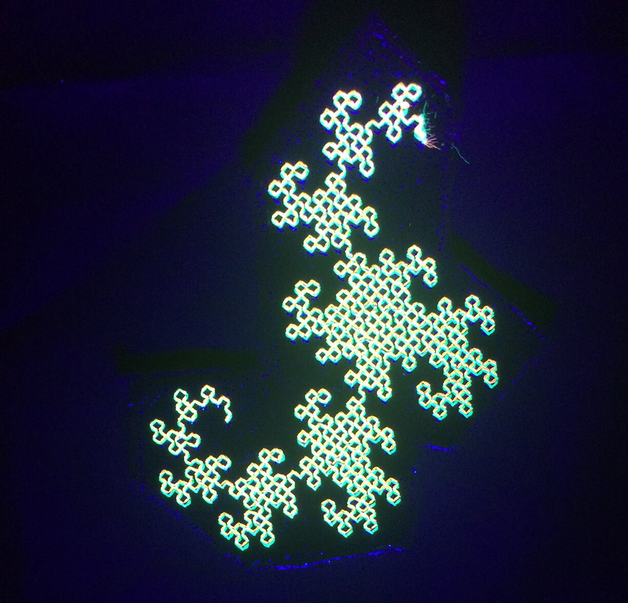 UV Reactive Dragon Curve embroidered fractal patch.