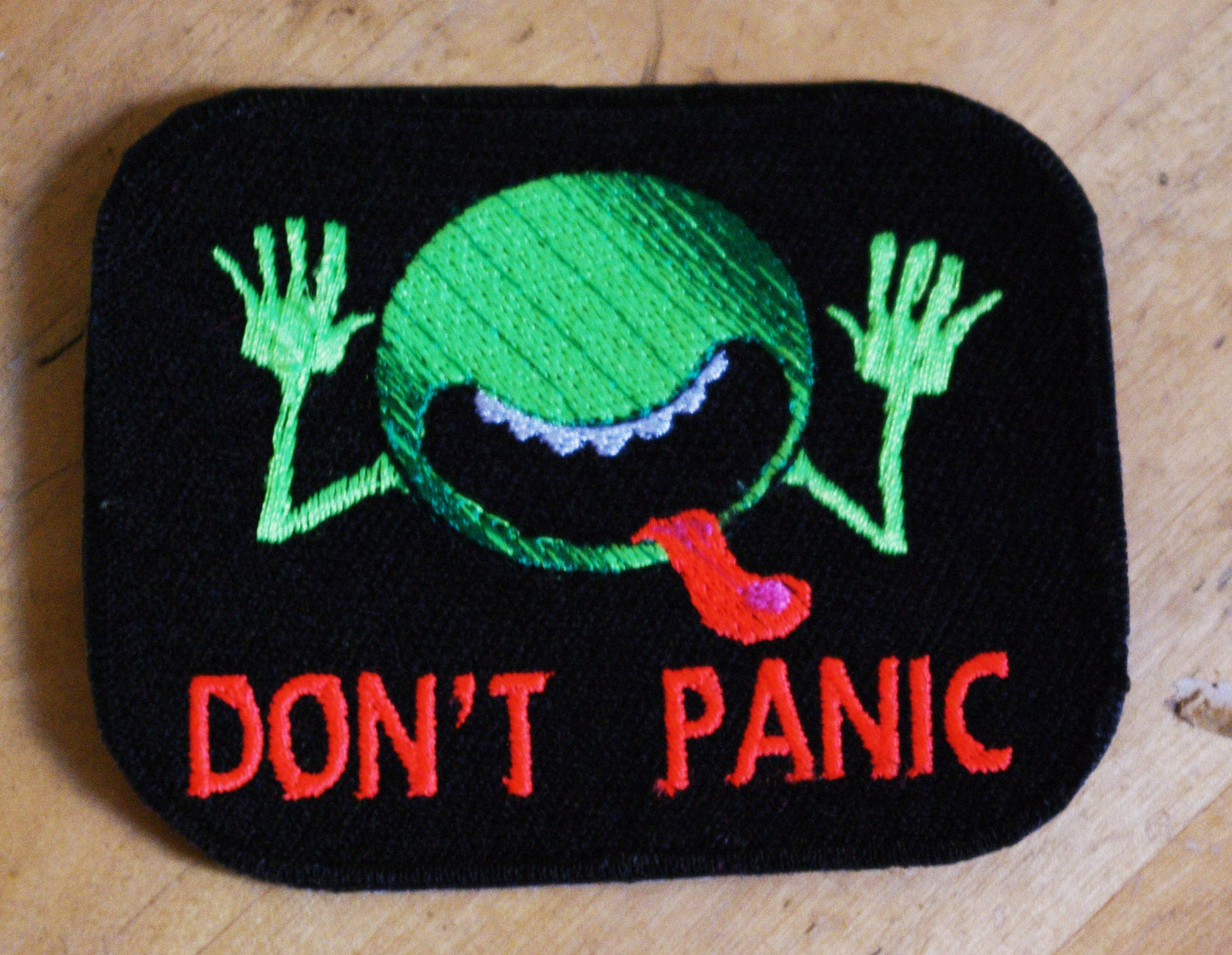 Don't Panic UV reactive iron-on patch